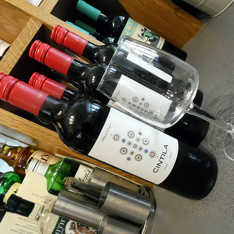 Cintila red wine bottles and glass